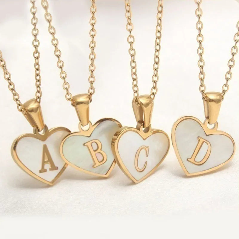 Gold-plated heart-shaped white shell necklace with adjustable chain and letter personalisation option