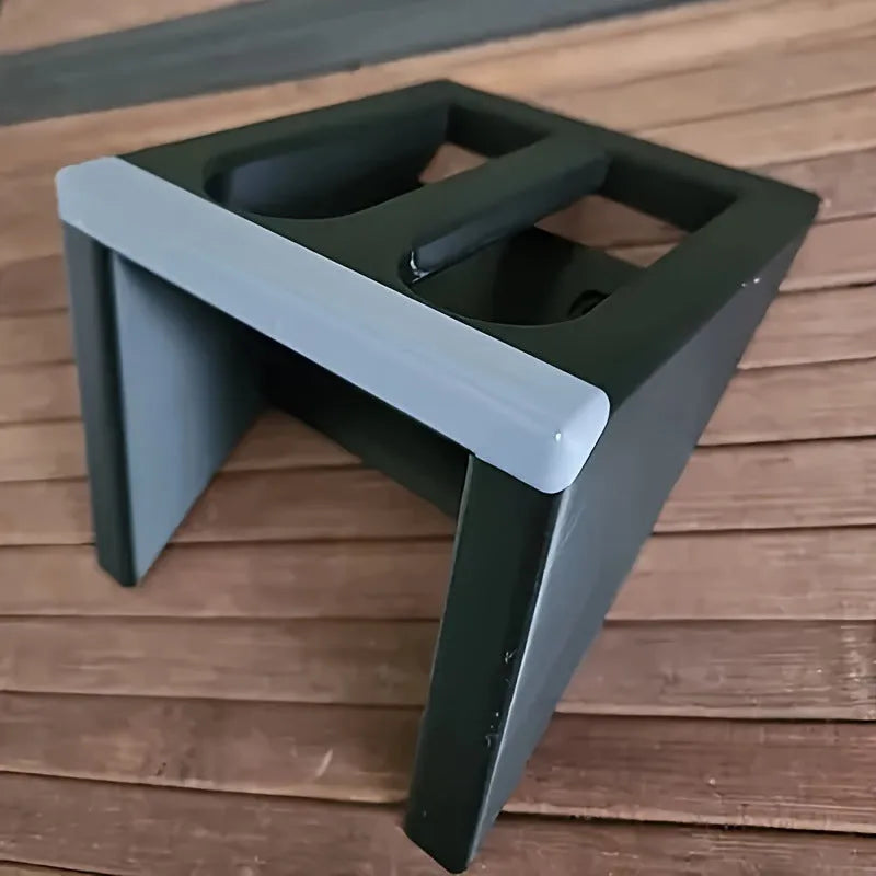 Black punk-style plastic pistol stand for displaying replica guns.
