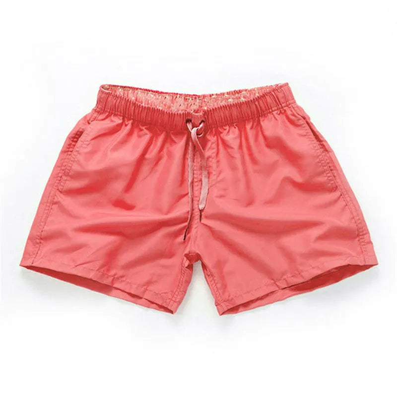 Men's polyester beach shorts in black with straight leg opening and grinded fabric texture available in sizes S to 4XL