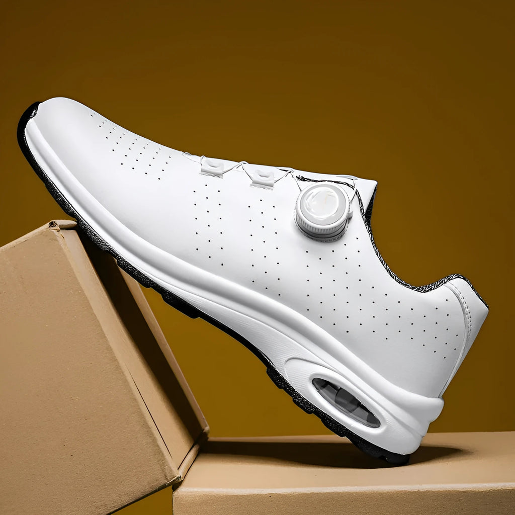 Men's black low-top casual shoes with mesh upper and white laces on a flat composite sole.