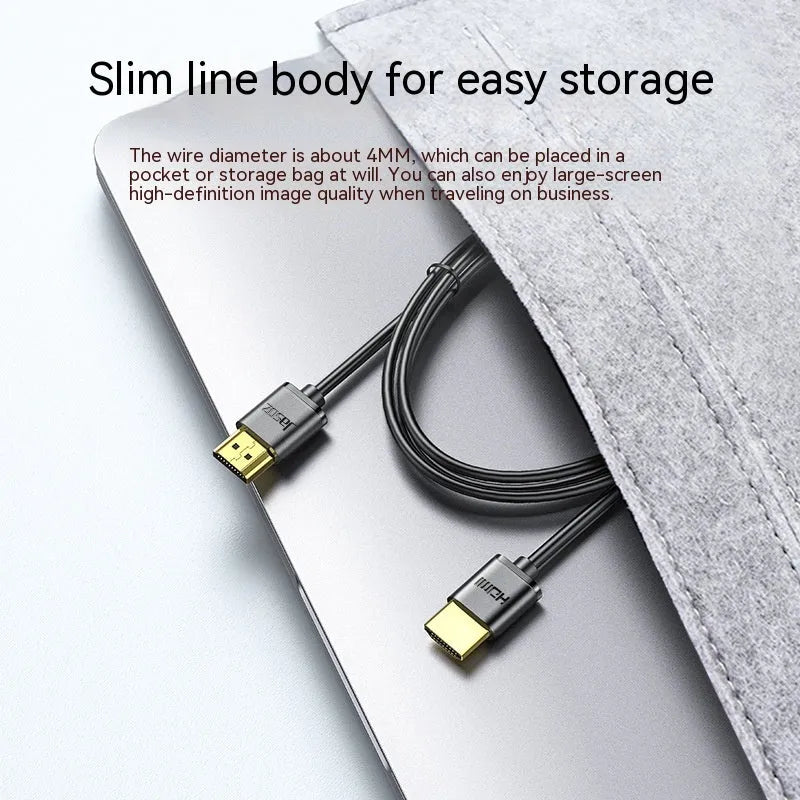 Flexible HDMI video cable with gold-plated connectors, shown in a hairline finish, suitable for computers and projectors.