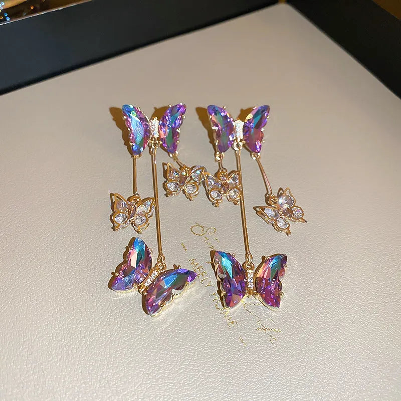 Blue purple butterfly tassel earrings with crystal flower decoration on silver electroplated alloy