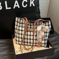Black woolen shoulder bag with horizontal square shape and internal organisation compartments