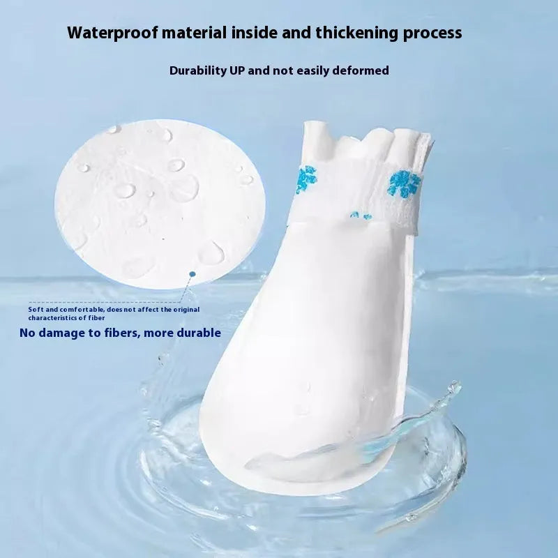 White disposable pet waterproof shoe covers for dogs in S and M sizes, made from non-woven fabric