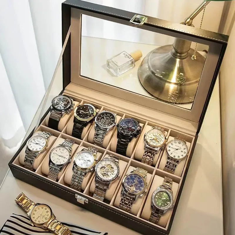 Grey leather watch storage box with clear dustproof lid showing watch cushions inside