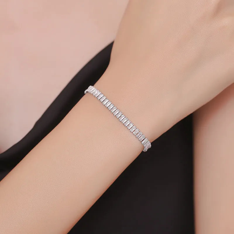 Geometric shape brass bracelet with full diamond zircon inlay in champagne gold colour.