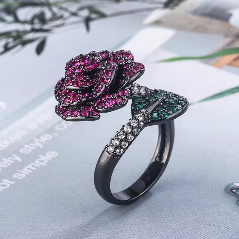 Black gold geometric floral ring with diamond-treated red corundum stone on copper band