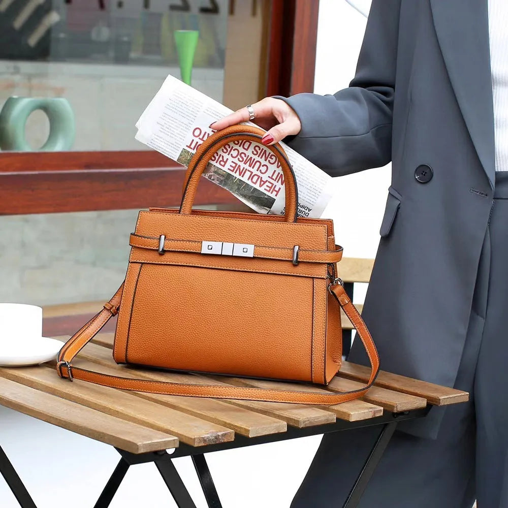 Genuine leather shoulder bag in horizontal square shape with multiple compartments and sandwich pocket design