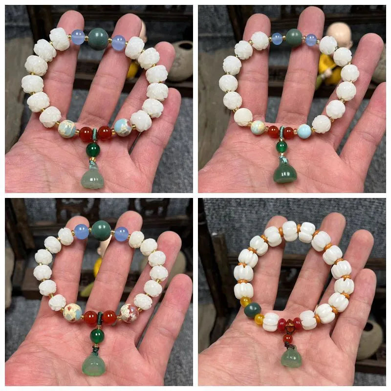 Carved bodhi root bracelet with pumpkin lotus beads and white jade lotus detailing in multiple bead sizes