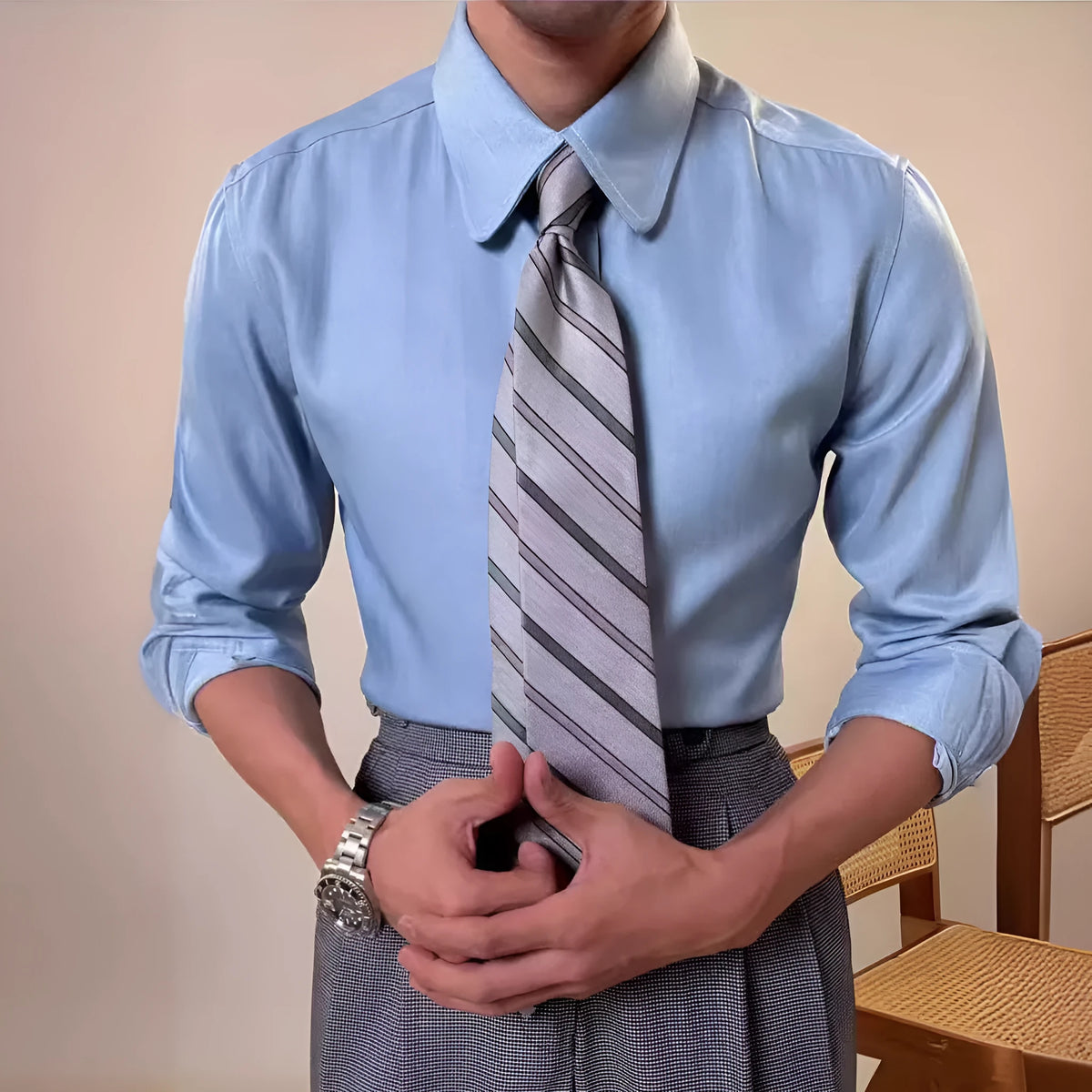 Man wearing a slim fit light blue long sleeve shirt with a round collar