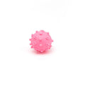 Bright coloured spiked dog ball with paw print dimples measuring 2 inches diameter for small dogs