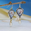 Retro blue bohemian drop earrings with lavender turquoise and pearl elements on geometric metal setting