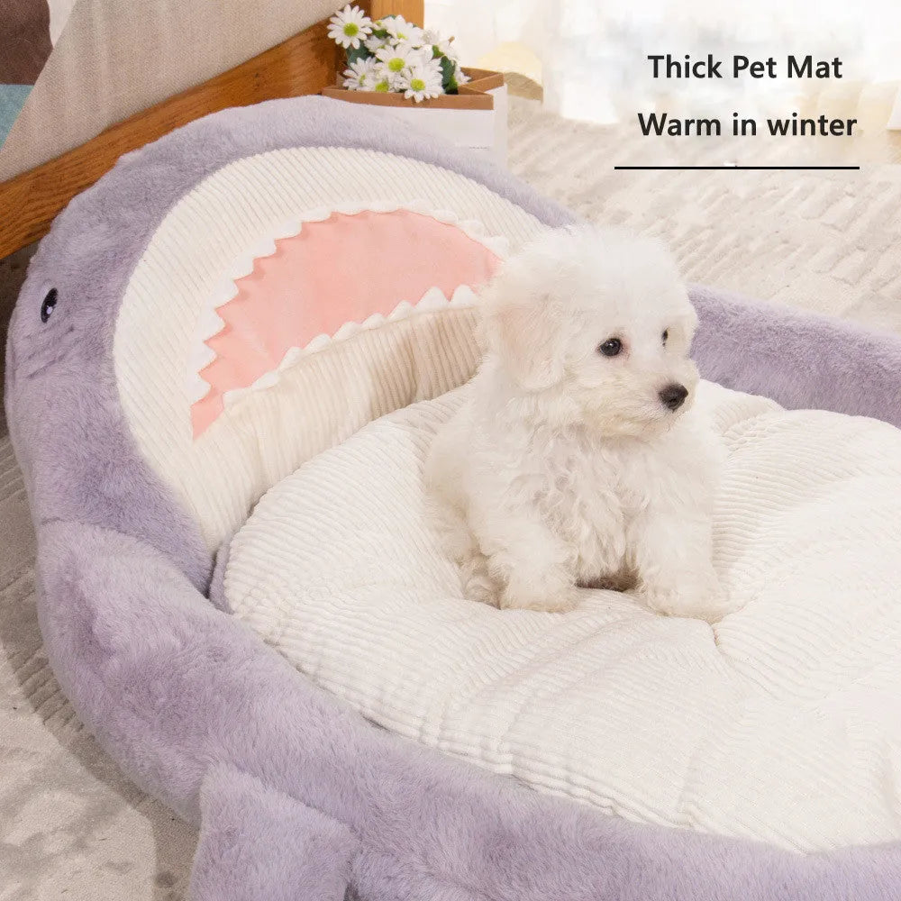 Blue shark pattern pet bed cushion on a hardwood floor, showing non-slip bottom.