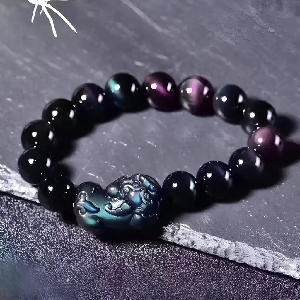 Natural grey obsidian crystal beaded bracelet shown in multiple bead size options on a wrist.