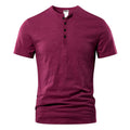 Man wearing a solid colour slub cotton short sleeve t-shirt in a casual setting.