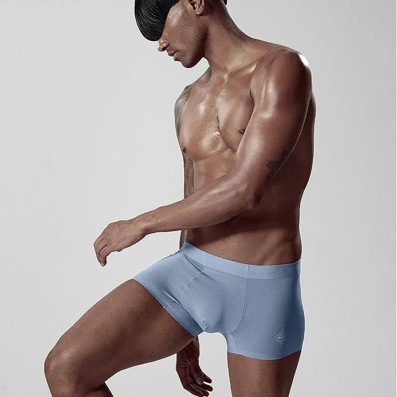 Men's seamless modal underwear in mid-waist style showing white, pink, and green colour options