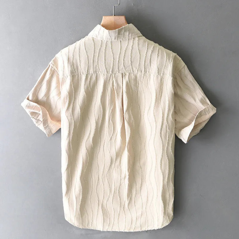 Man modelling a loose-fit apricot pure cotton short sleeve casual shirt