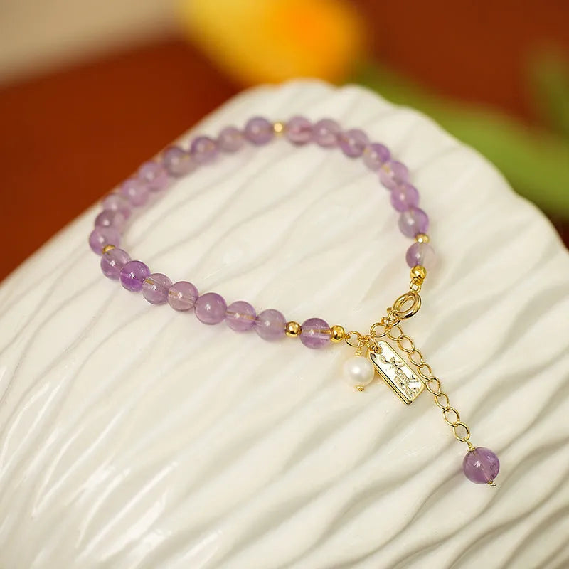 Women's natural crystal amethyst bracelet in romantic lavender colour with zodiac modelling design