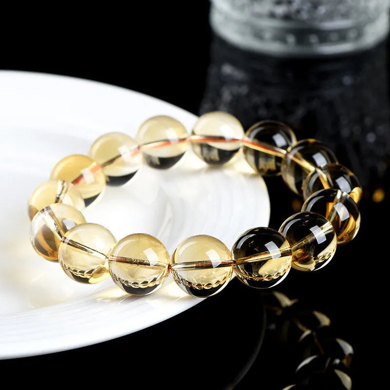 Natural citrine scattered beads ball bracelet showing polished gemstone beads in yellow-amber tones on a wrist.