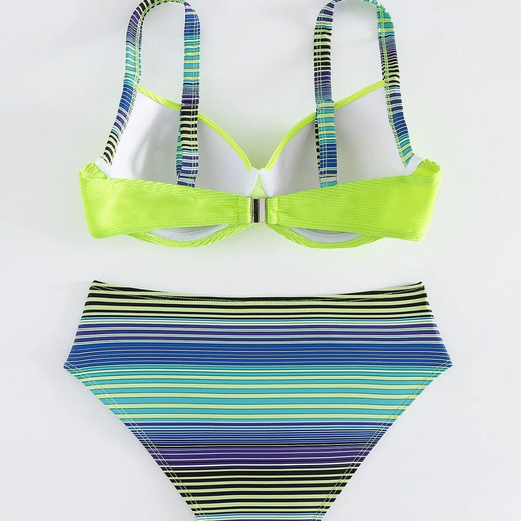 Green printed women's halterneck bikini top and split-style briefs set on a white background.