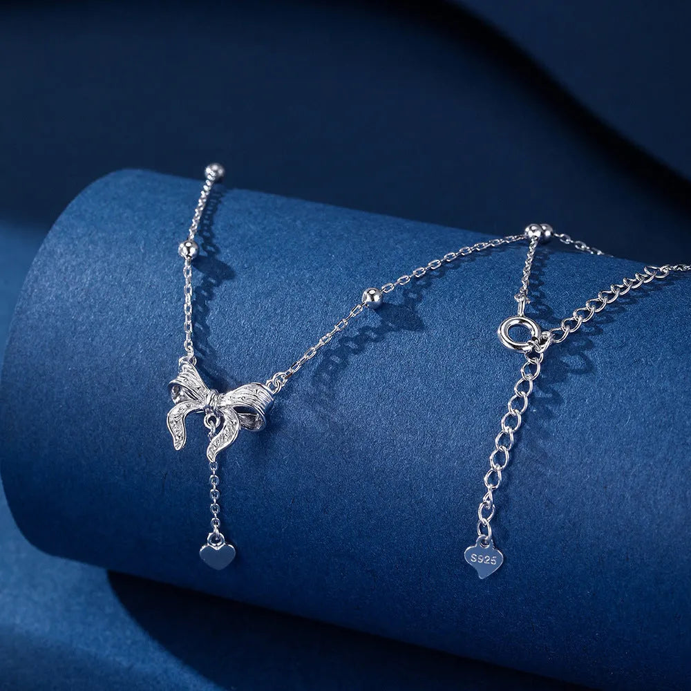 S925 sterling silver necklace with heart-shaped butterfly pendant on an adjustable O-ring chain.
