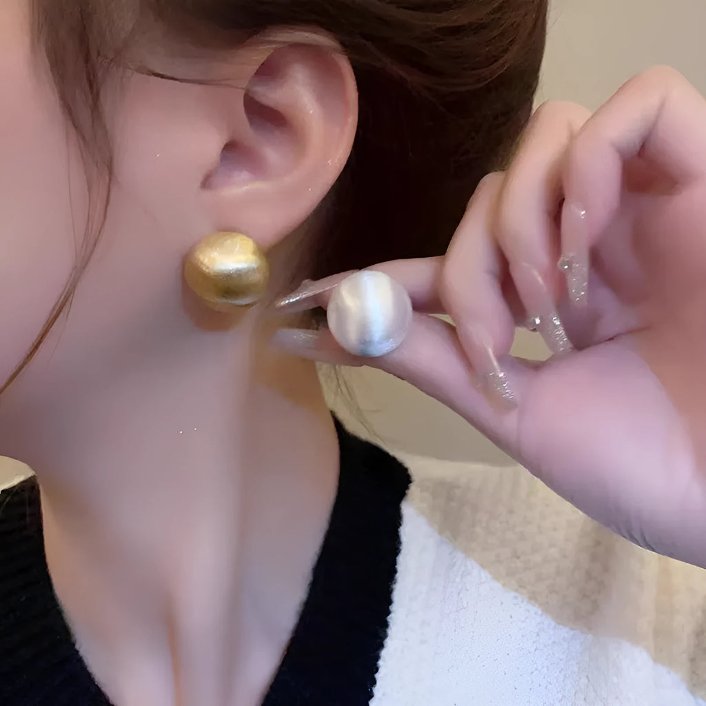 Matte brushed bean-shaped stud earrings in Gold and White for women, compact versatile metal earrings