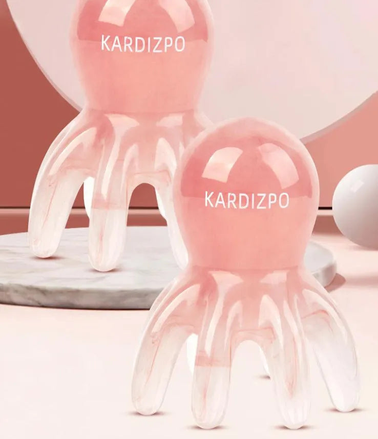 Pink octopus-shaped massage comb made from natural resin with included storage bag for facial meridian therapy