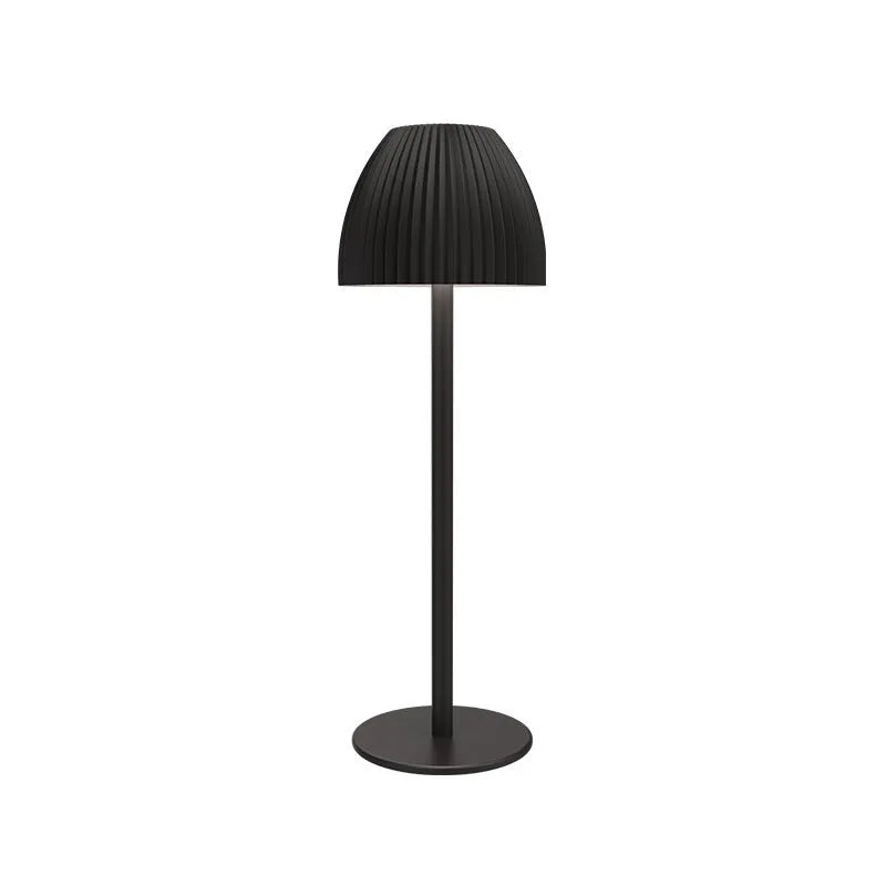 Ins pattern dimming small night lamp in thin round base black or white on a table.