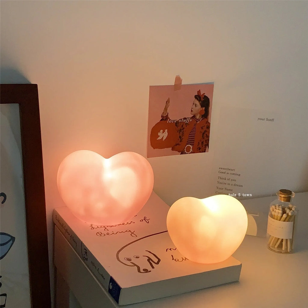 Vinyl atmosphere lamp in white and pink colours showing small and large size options