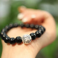 Black agate bead bracelet with sterling silver fastening on wrist