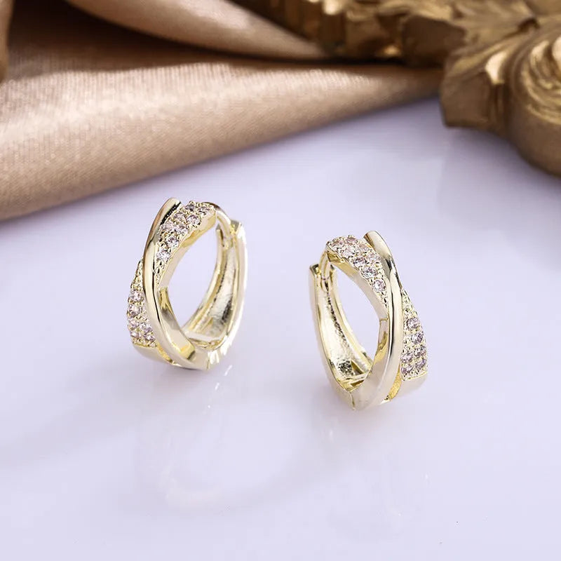 Geometric wild earrings in copper with zircon details and 14K yellow finish