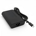 Black oval USB-C 65W laptop power adapter with international plug compatibility