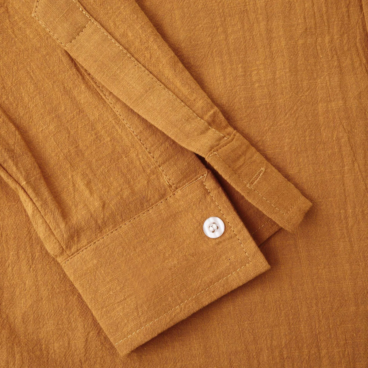 Men's slim fit brown long sleeve shirt and matching casual trousers on a hanger.