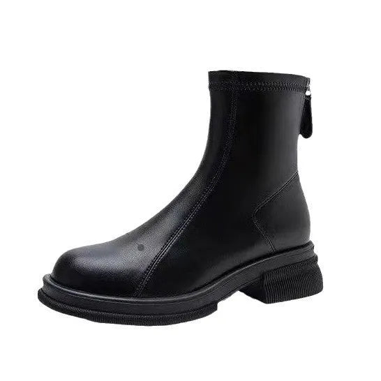 Women's black ankle boots with a thick flat heel, round toe, and back zip fastening.