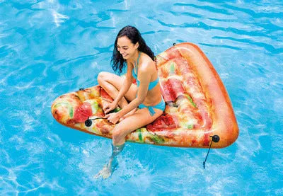 Large inflatable pizza slice surfboard recliner floating in a pool, showing its 175cm length and colourful design.
