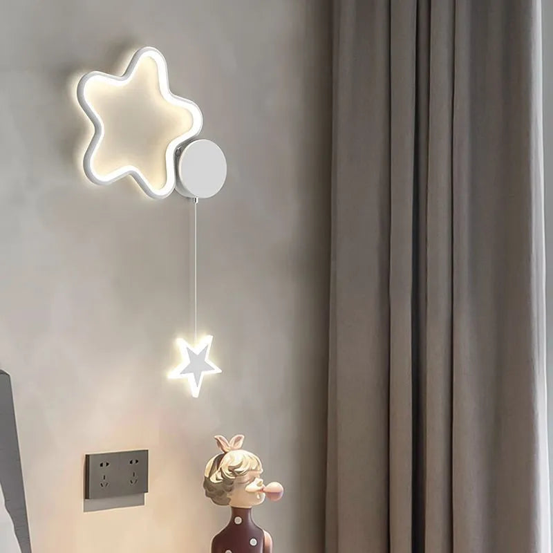 Cloud and star shaped children's bedside wall lamp with LED lighting in black or white finish