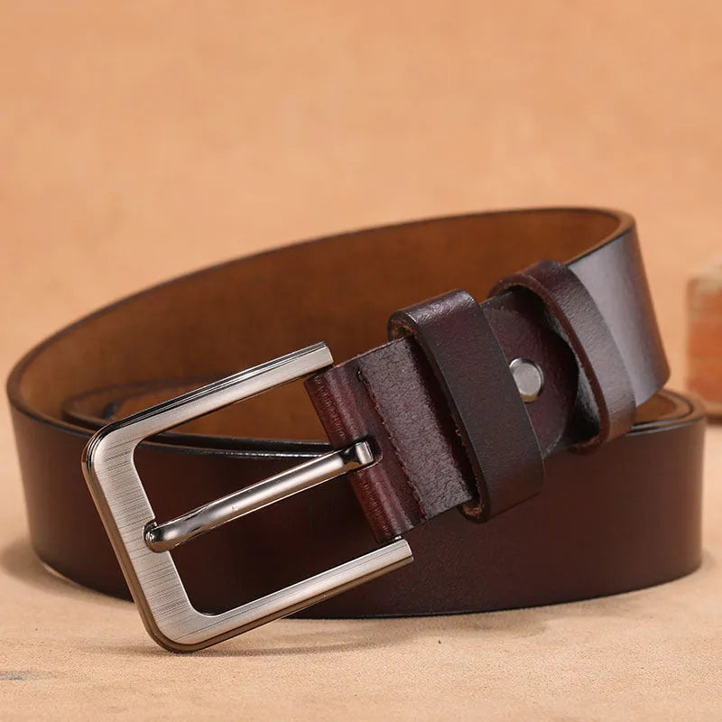 Men's black casual belt with a square silver alloy pin buckle on a length of belt strap.