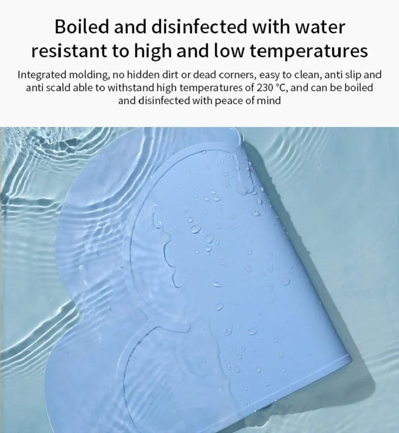 Blue waterproof silicone pet feeding mat for dog and cat bowls on a wooden floor