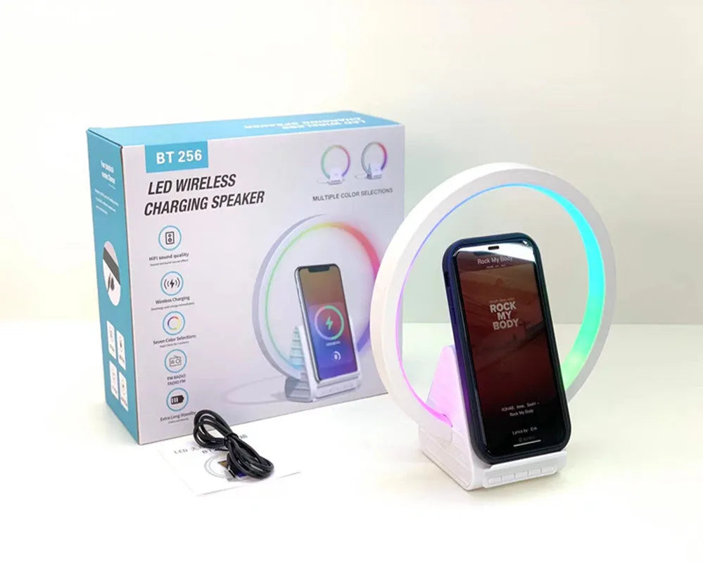 White smart Bluetooth speaker and wireless charging pad with ambient light, showing slim 10mm profile