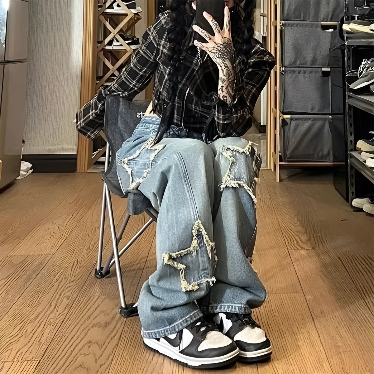 Blue high-waisted wide-leg denim jeans with a straight-leg cut on a model