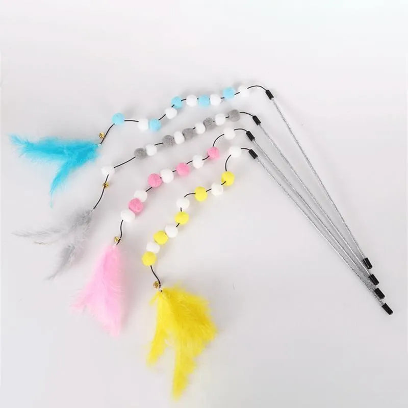 Grey cat teaser rod with yellow pompon feather and bell, shown at full 31cm length.