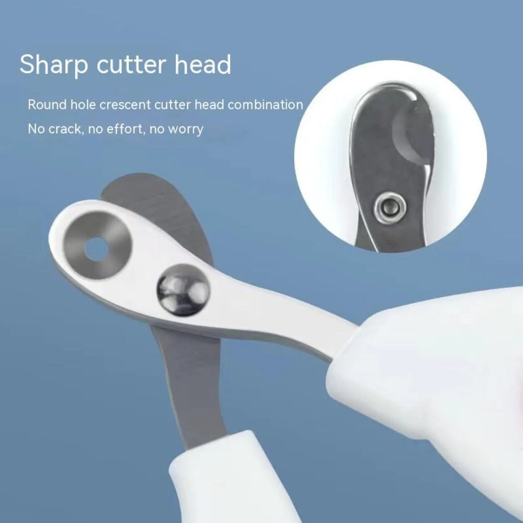 Blue cat nail clippers with circular cutting hole and cushioned handle on a white surface.