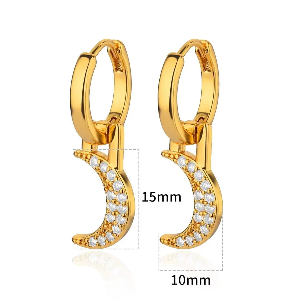 A pair of women's geometric butterfly-shaped earrings made from copper with heart and star details.