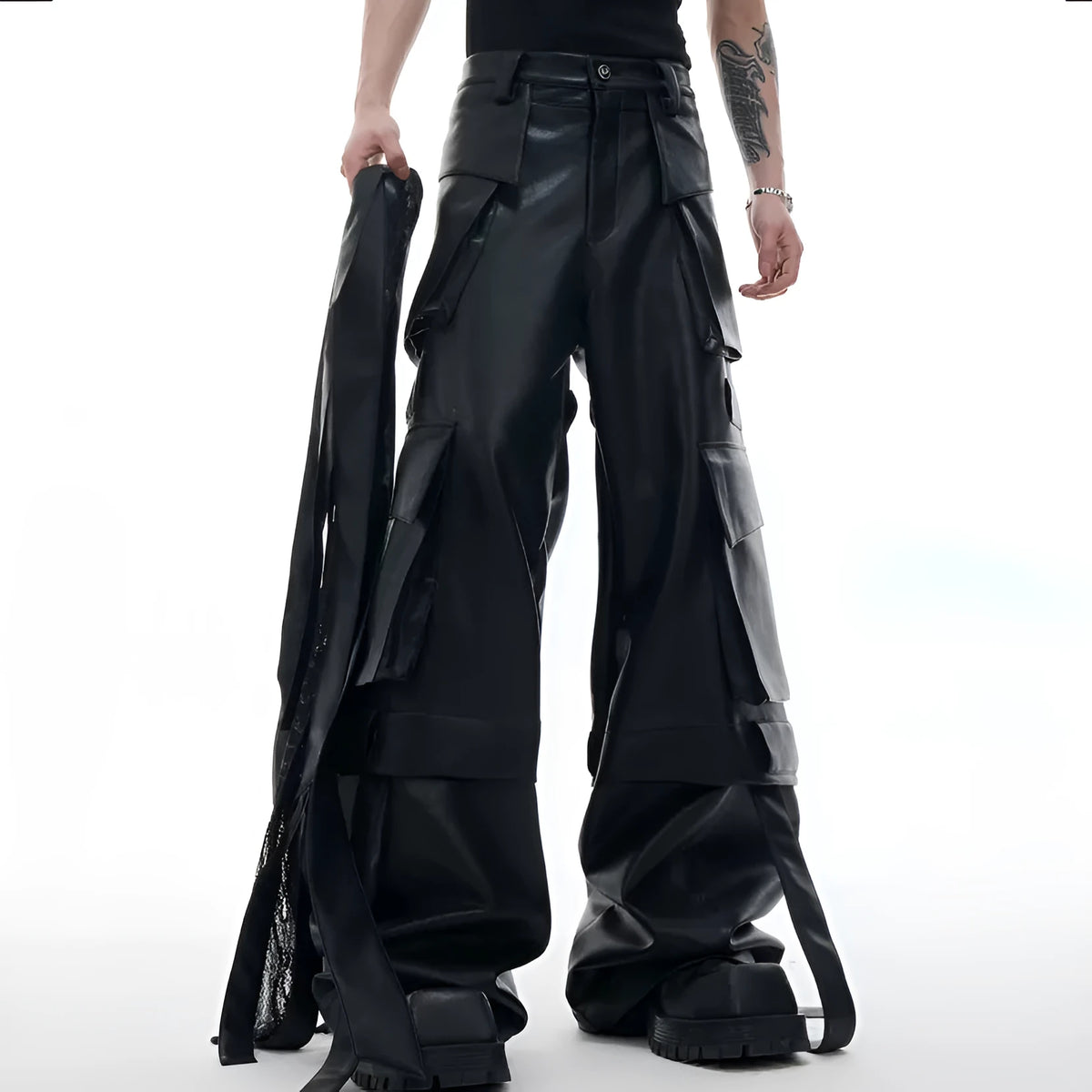 Black loose-fit men's trousers with quilted panels and multiple pockets.