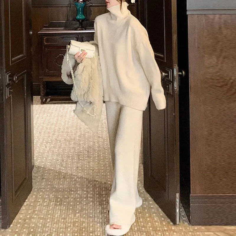 Women's milky white acrylic fibre sweater and wide-leg trousers two-piece set on a hanger.