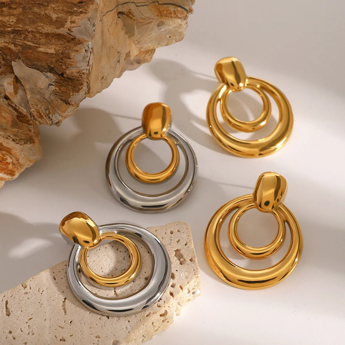 Golden round double layer hollow stud earrings with geometric design and hypoallergenic titanium steel construction