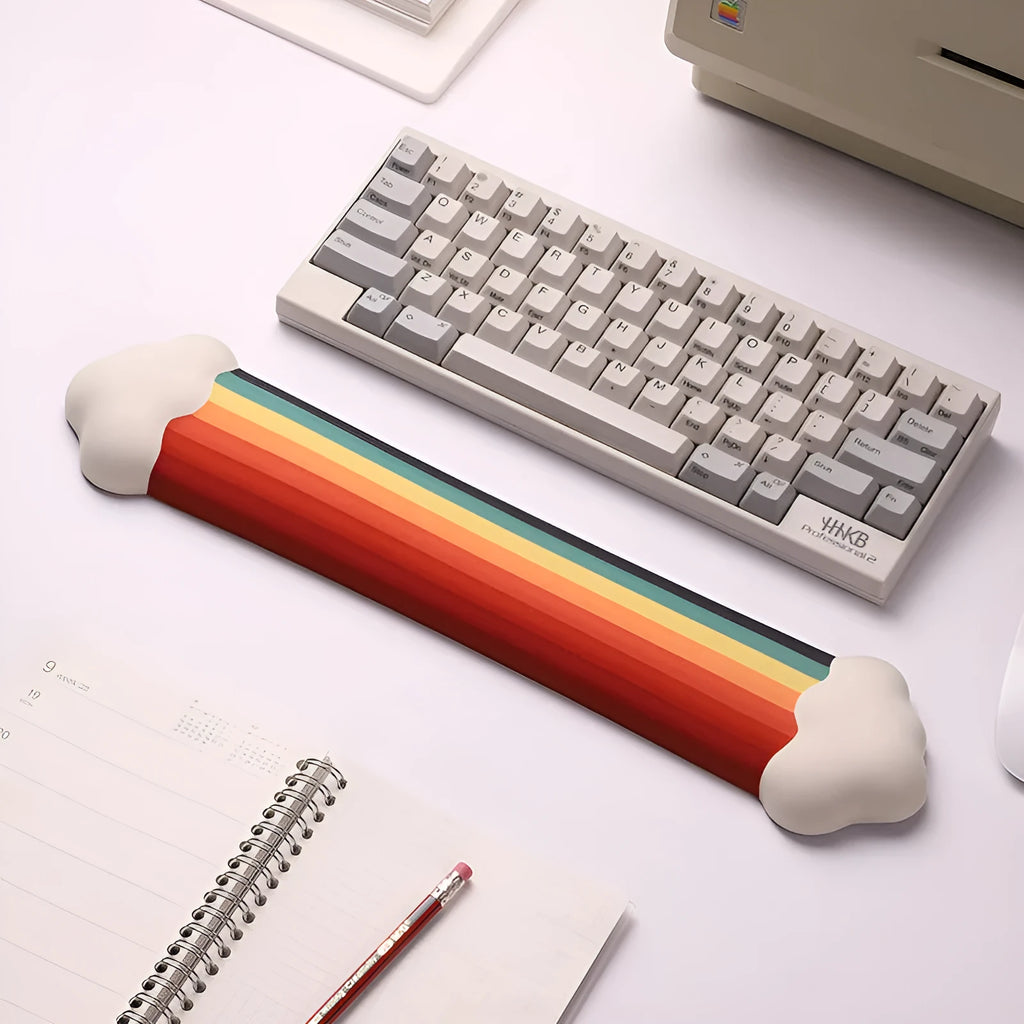 Silicone gel wrist rest mouse pad and keyboard support set in Cloud Rainbow design on a desk