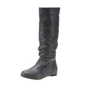 Women's flat heel slip-on boot in artificial PU with high cut and rubber sole.