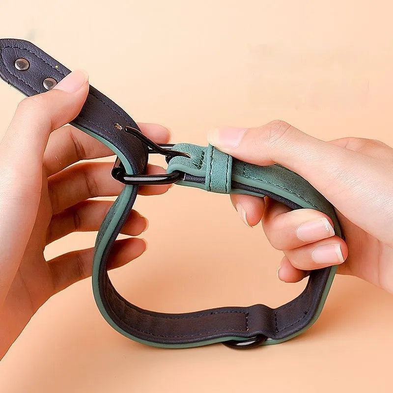 Adjustable double-layer dog collar in purple, showing PU front and microfiber back, with a buckle.