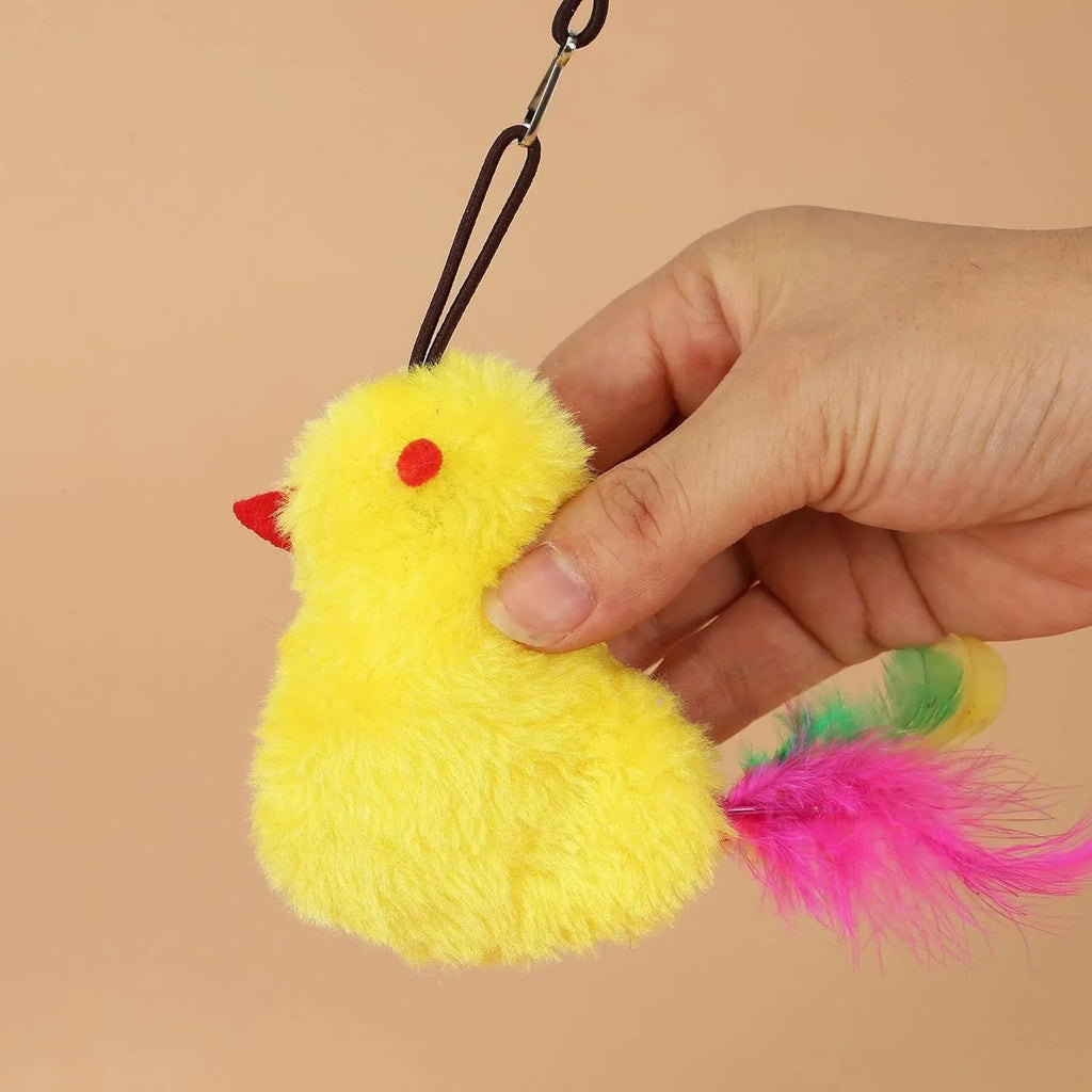 Grey and yellow interactive cat toy hanging on door with dangling mouse, treat bulb, and retractable cord